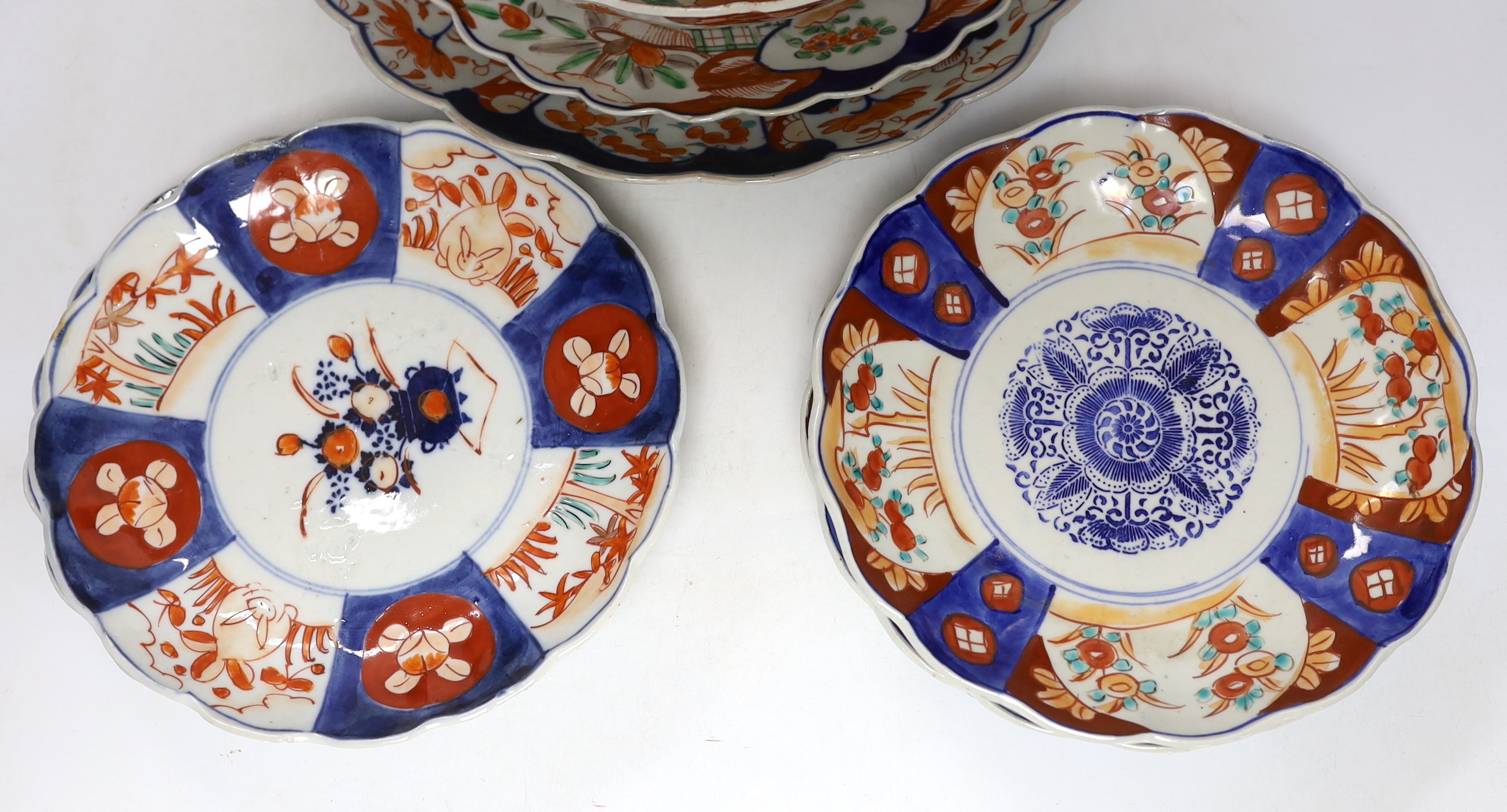 A group of Japanese Imari plates, dishes, a bowl and a vase